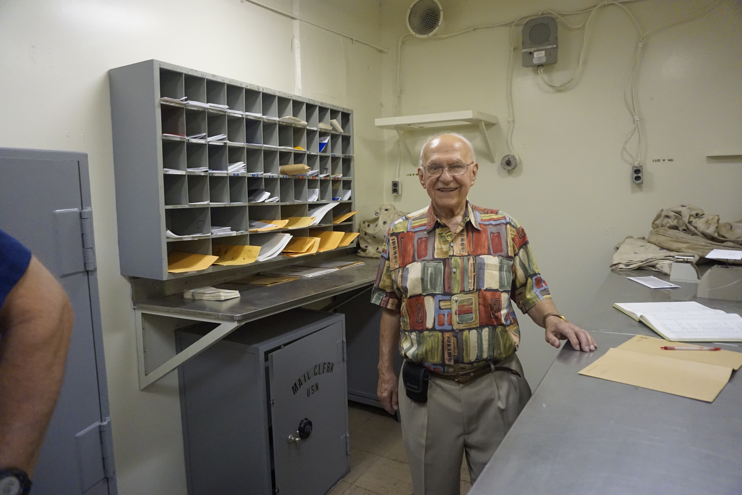 14. Dad in the mailroom where he worked on the ship